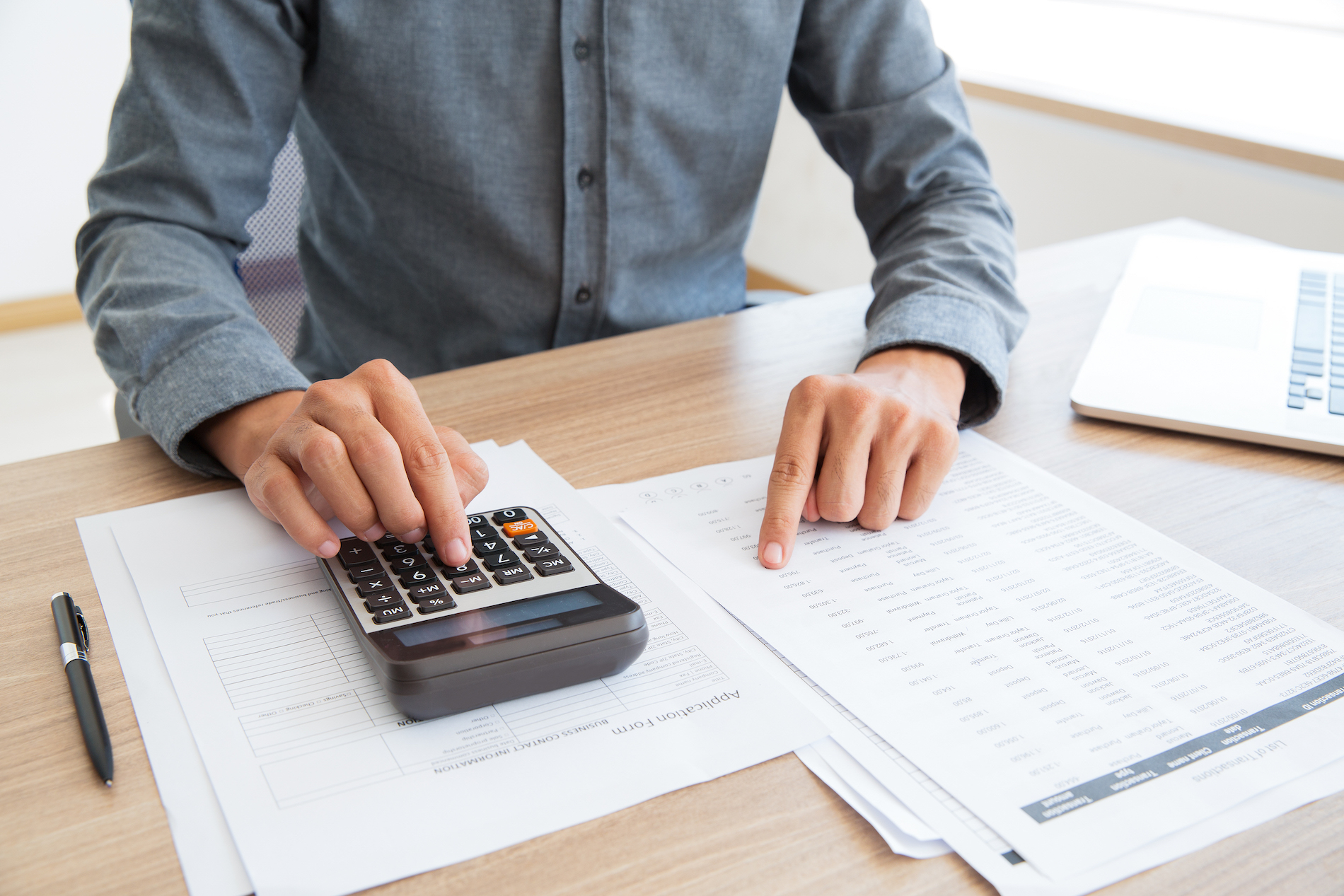 Person calculating documents